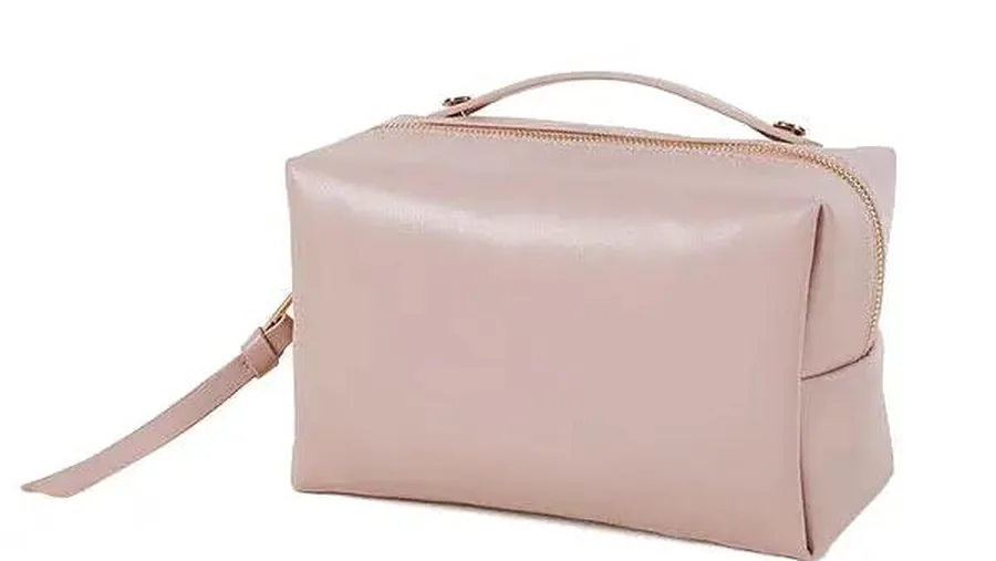 Cosmetic bag with drainage eyelet